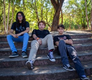 three-young-men-sitting-on-outdoor-stairs-8ar7qklkhcq