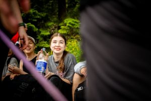 young-woman-smiling-while-holding-a-water-bottle-s-3ivjylnju